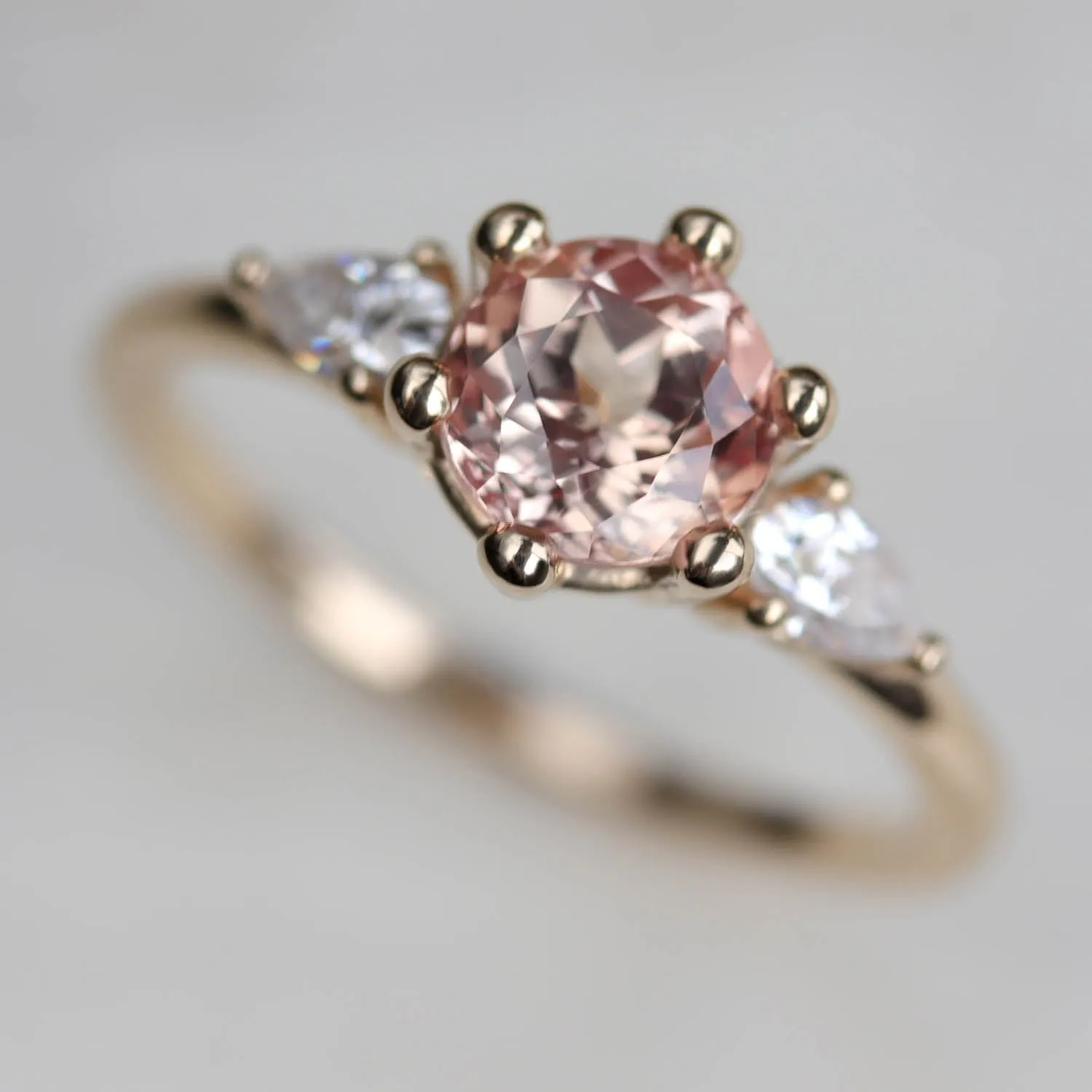 6mm Prong-set Three Stone Ring with Pear-Shaped Side Stones